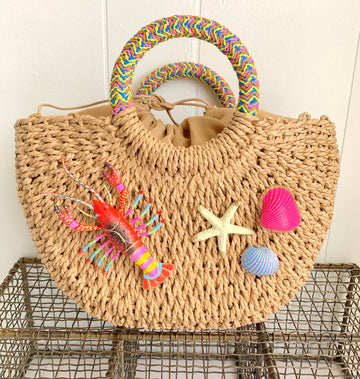 Straw handbag with round handle embellished with hand painted lobster and seashells. Summer tote bag for women.