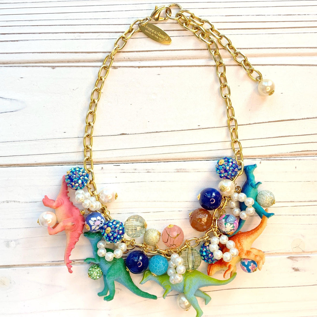 Colorful dinosaur charm necklace. Dinosaur charms on a gold chain. Whimsical necklace for women.