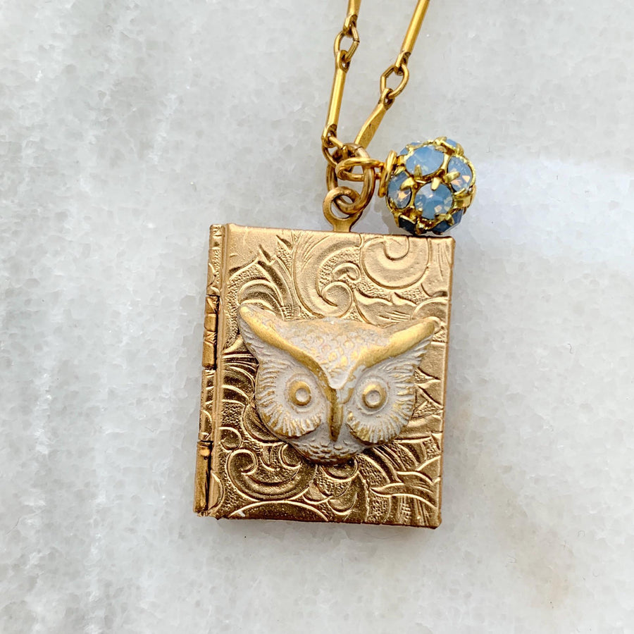 Gold book locket necklace with owl detail on a gold chain. Gold photo locket for women.