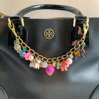 Gold bag chain with hand painted wood safari animals and a mix of colorful beads. Chain bag charm for handbags.