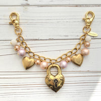 Gold chain bag charm with dangling gold hearts. Valentine&#39;s Day heart bag charm.