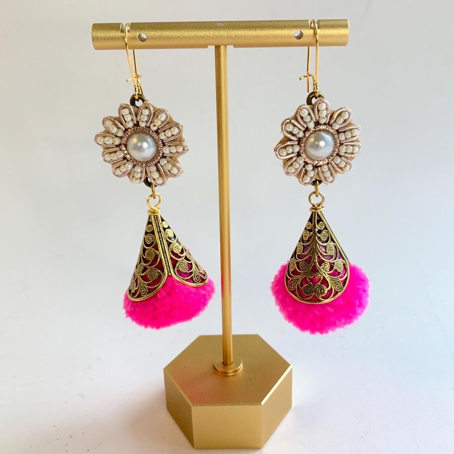 Pearl and seed bead flowers with hot pink pom pom encased in brass filigree bead caps. Cute handmade dangle earrings for women. Hot pink earrings.