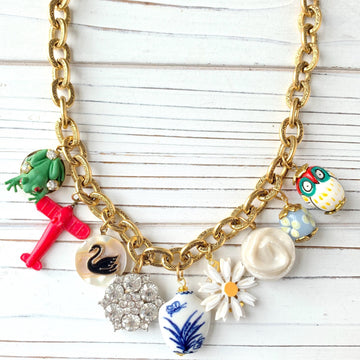 Trendy gold chain charm necklace.