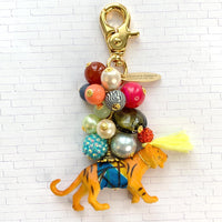 Tiger bag charm with gold trigger clasp, colorful mix of beads and embellished miniature tiger figurine.