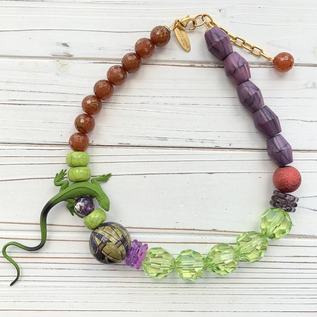 Lizard necklace with green, purple, and brown beads. Purple and green statement necklace for women.